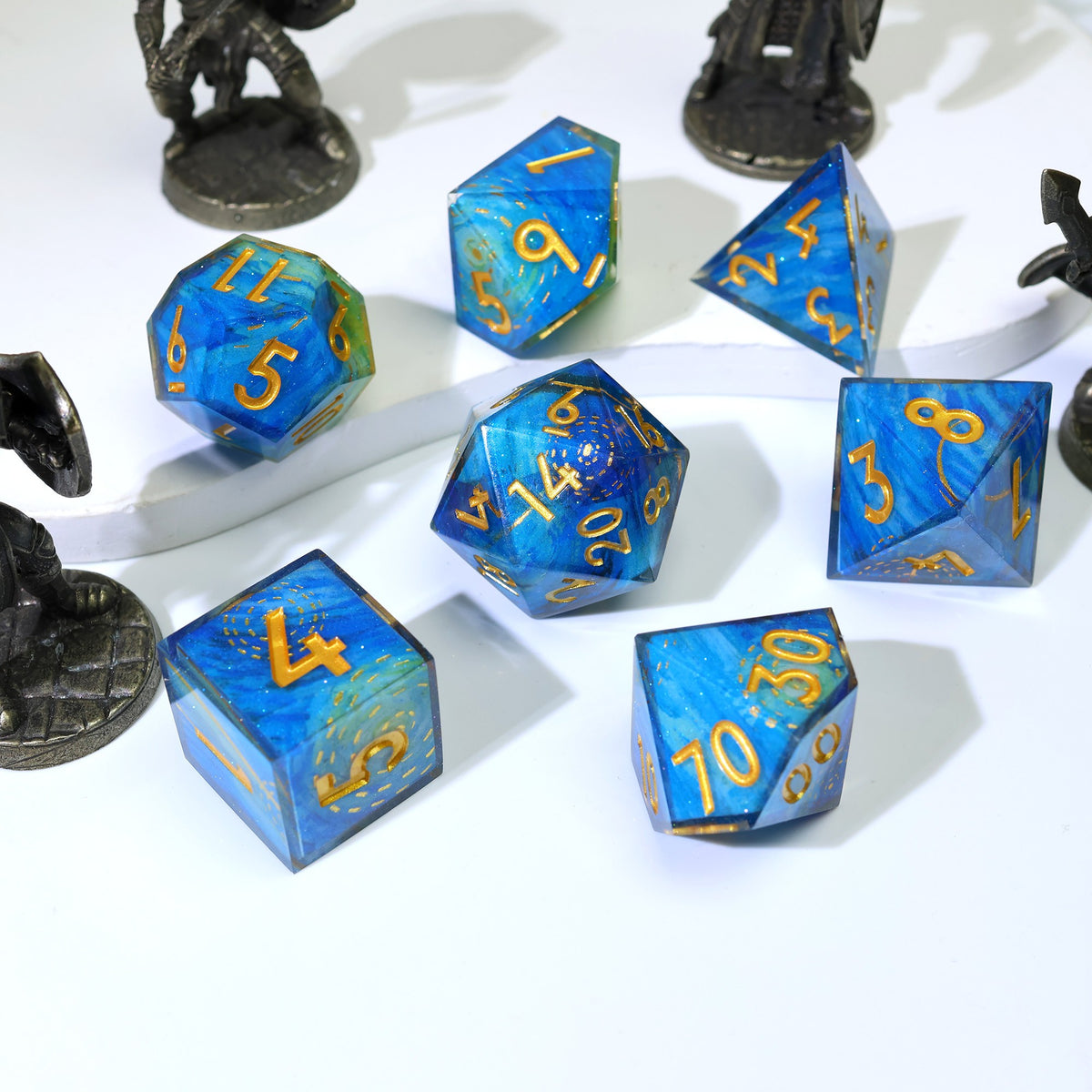 Deep blue swirl resin dice set with gold numbers