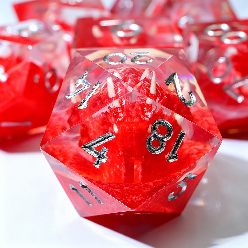 Red resin d20 with a fuzzy red dragon inside and silver numbers