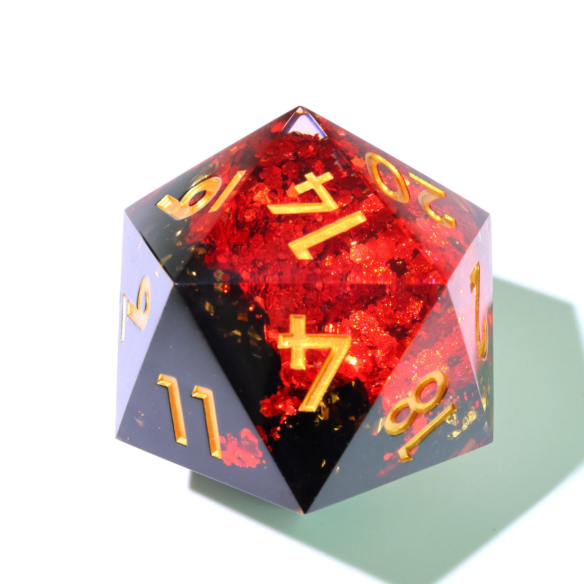 50 mm red geode resin d20 with a gold seam and gold numbers