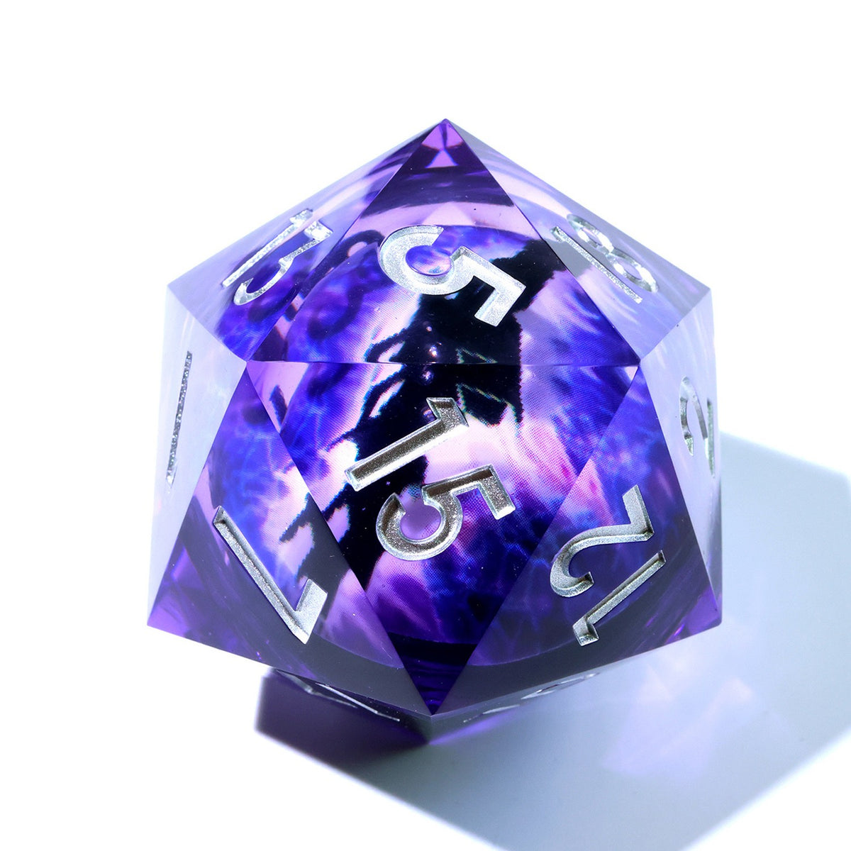 33 mm purple resin d20 with a black dragon silhouette and silver numbers