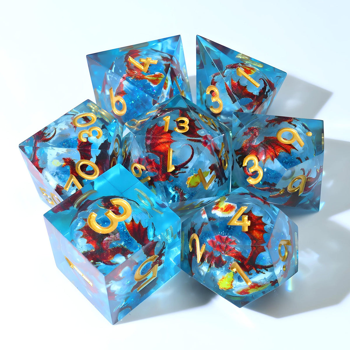 Ocean blue resin dice set with red dragons and gold numbers
