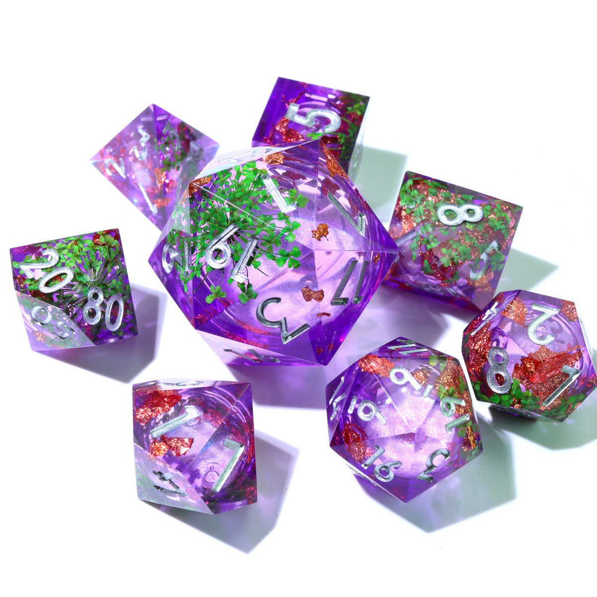 Violet liquid core resin dice set with green flowers, copper flakes and silver numbers